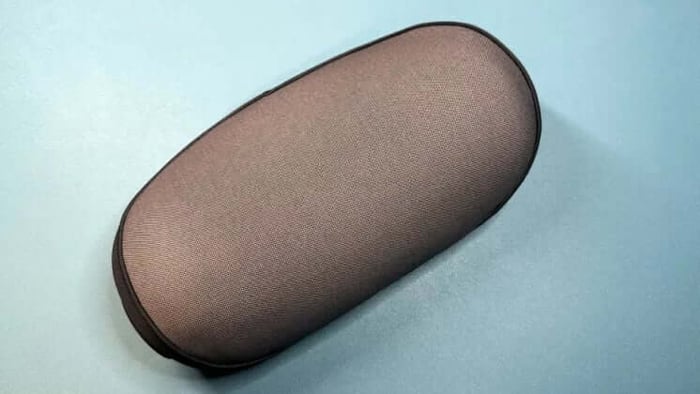 The cushy neck pillow doubles as a surround sound satellite speaker