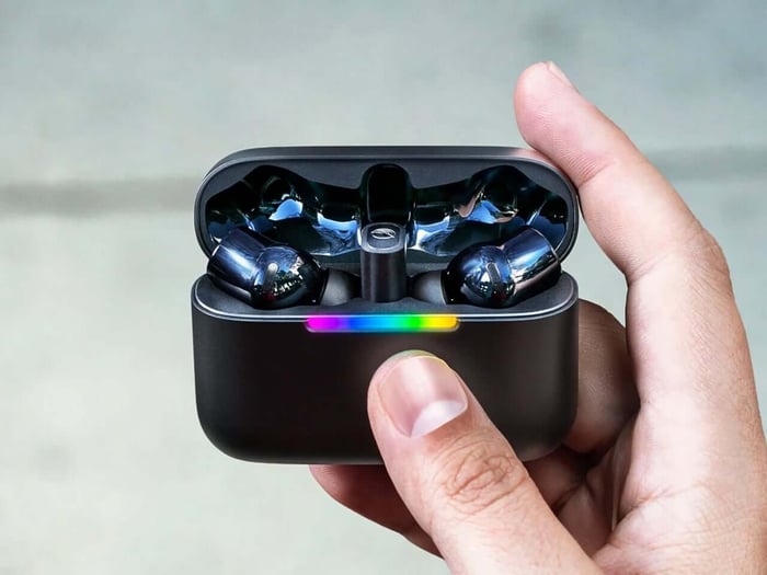 Razer Hammerhead V3 HyperSpeed earbuds on a tech surface
