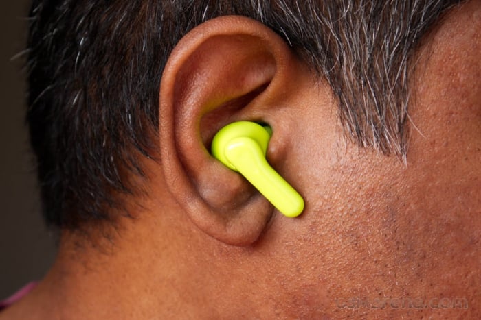Lifestyle shot of the earbuds in use