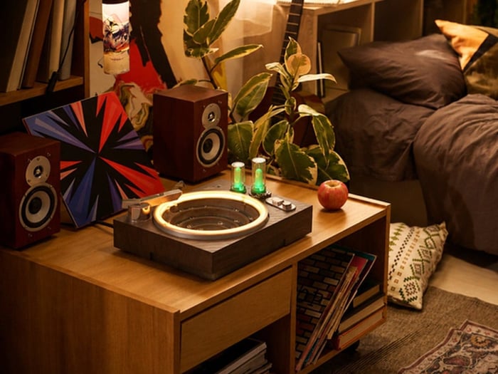 Wood-grain textured body and metal accents on the ambient water player