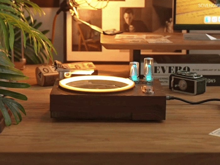Compact ambient player designed for a desk, shelf, or bedside table