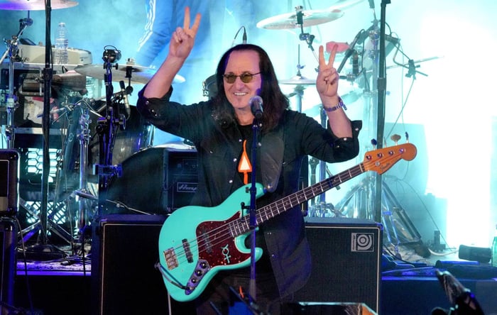 Geddy Lee performing with Rush, capturing the intensity of the band’s energy.