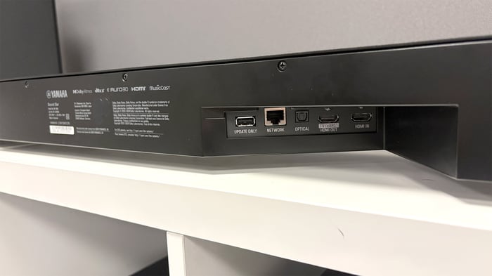 Top controls of WS-X3A surround speaker for pairing and volume.