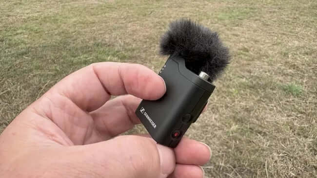Transmitter showing buttons and lockable TRS port.