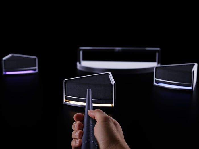 Adjusting individual speaker volume with baton