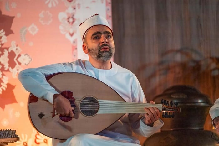 Musician performing in an intimate acoustic setting.