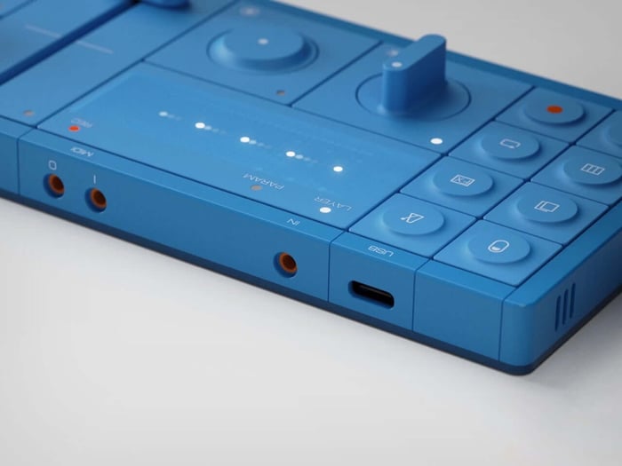 Side view highlighting joystick and buttons