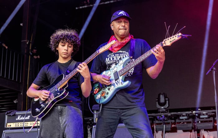 Tom Morello and Roman Morello performing together on stage