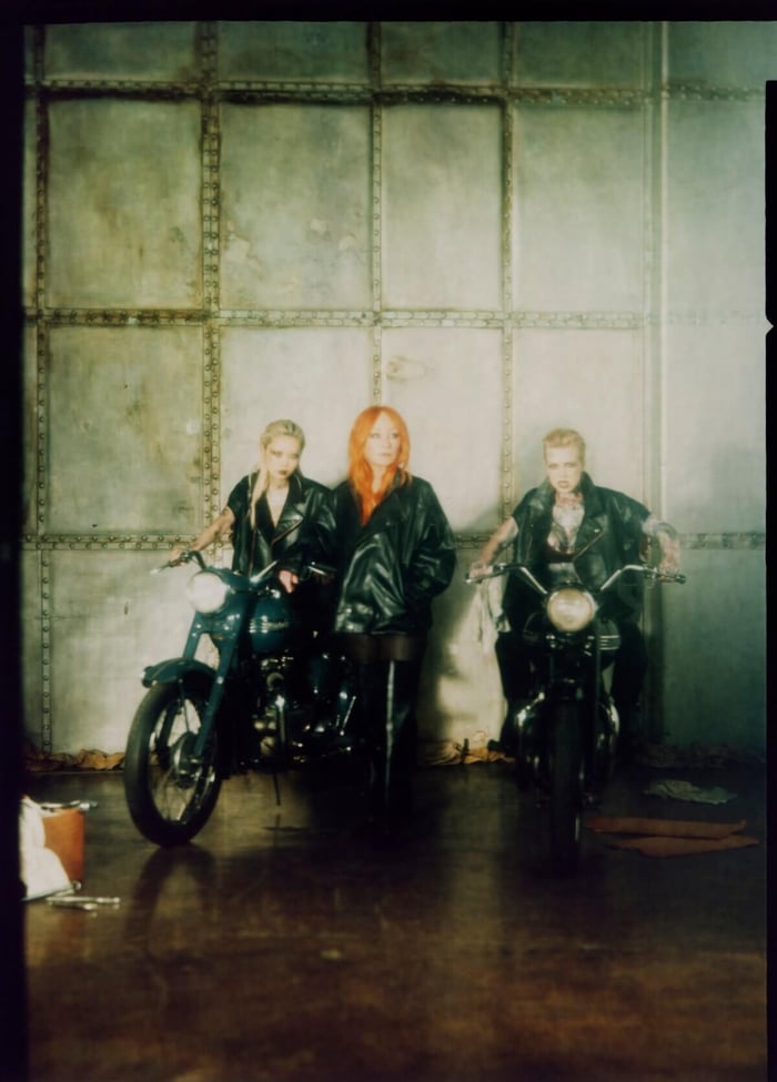 Tori Amos and two models in a promotional photo for “Gasoline Girls” from her new album, In Times of Dragons. (Credit: Kasia Wozniak)