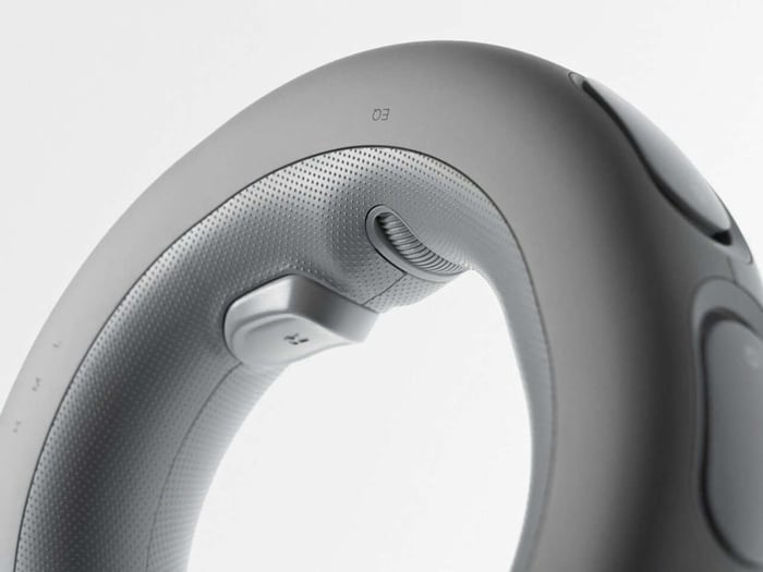 Magnetic earbuds snap into the speaker ring, blending convenience with style.