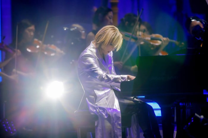 YOSHIKI at the piano, lost in music