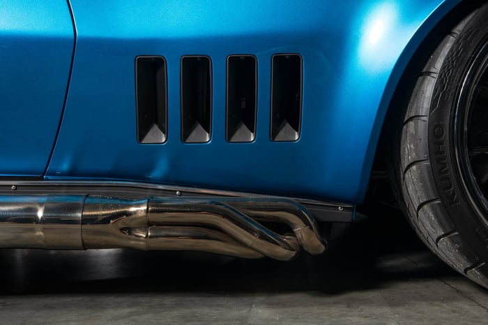 Custom Hooker side pipes mated to Detroit Speed side pipe tubes.