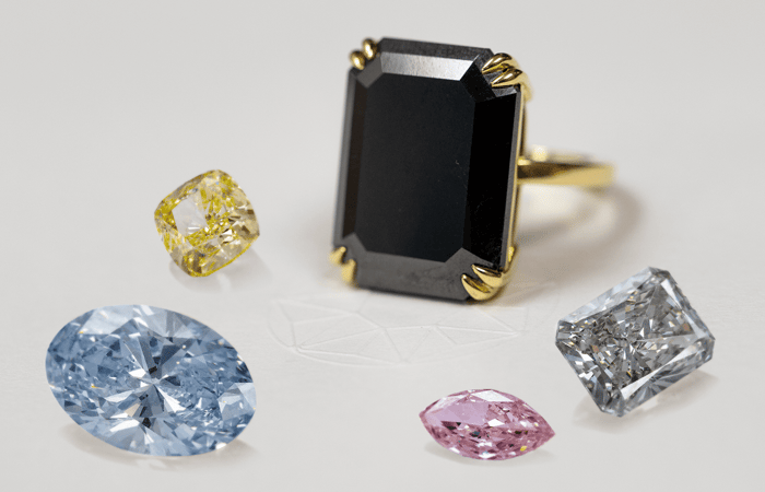 A selection of fancy coloured diamonds including pink, blue, yellow and green stones