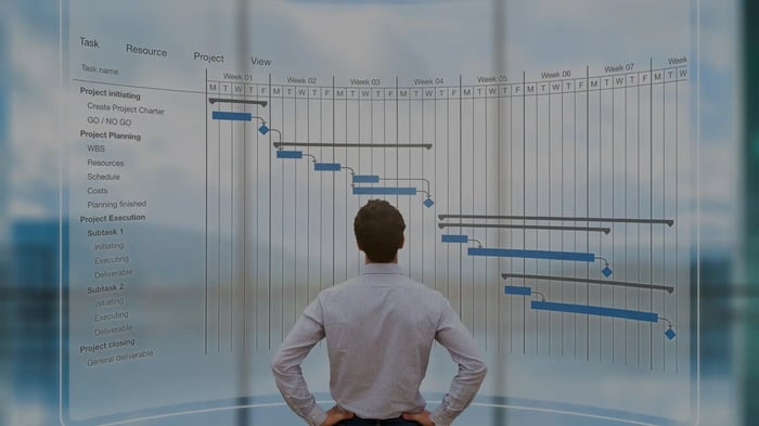 A professional pmp certificate holder looking at project dashboard