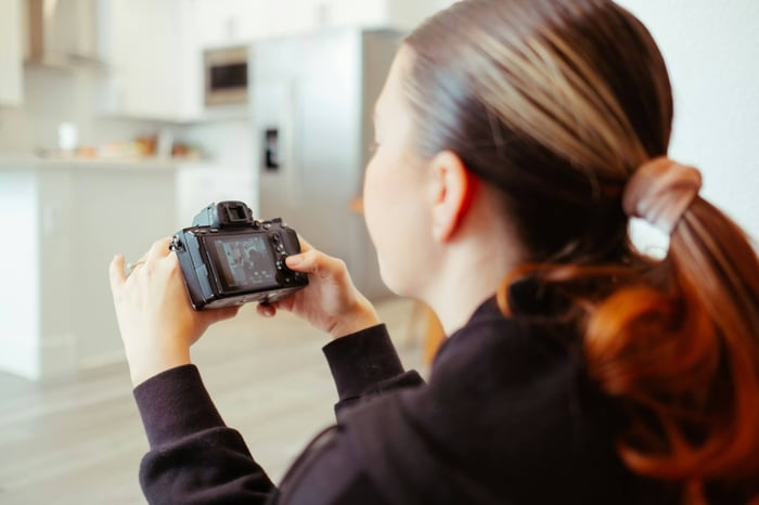 Woman Checking Video - How to Make Video Quality Better