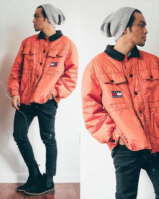 person wearing a bright orange jacket and grey beanie