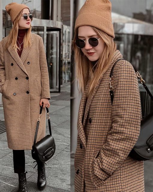 person wearing a beige beanie and long checkered coat