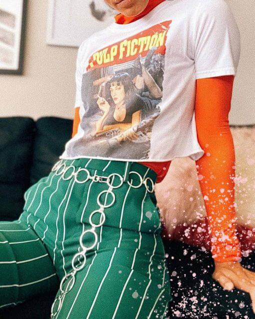 Cropped pulp fiction t shirt over a red turtleneck.