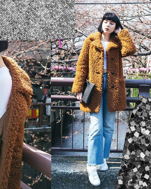 Woman wears a teddy overcoat with a white corp top underneath.