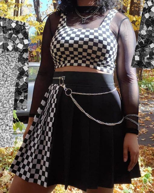 A checkered crop top over a mesh long sleeve shirt.