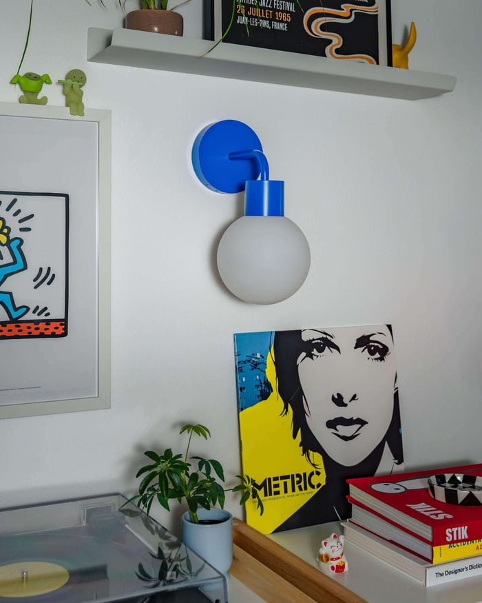 blue-rechargeable-wall-sconce-with-artwork