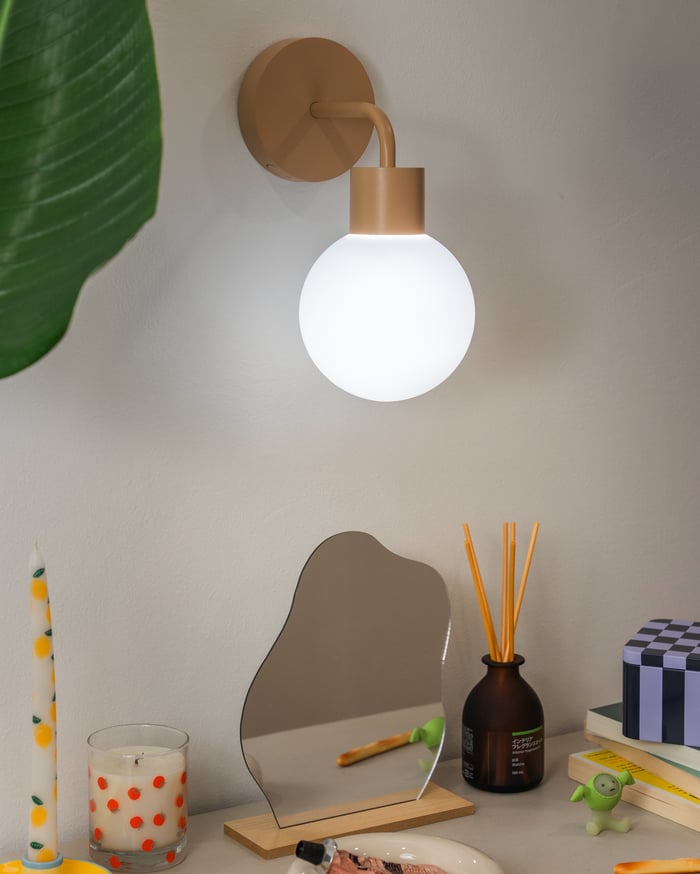 Stick-on wall sconce above a minimalist side table set-up