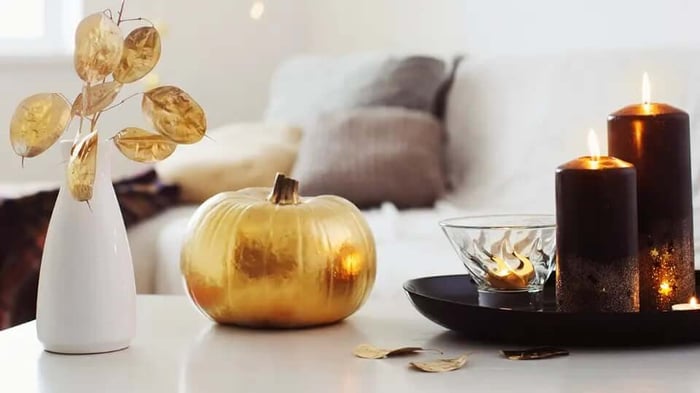 a gold pumpkin decorating a table