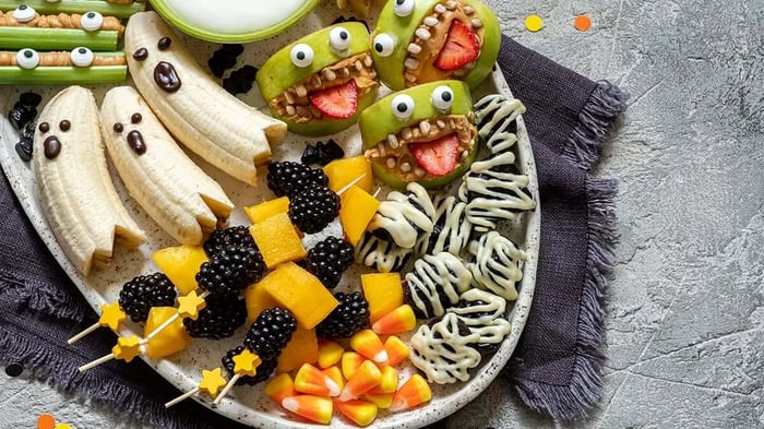 creepy halloween-themed snacks including ghost bananas