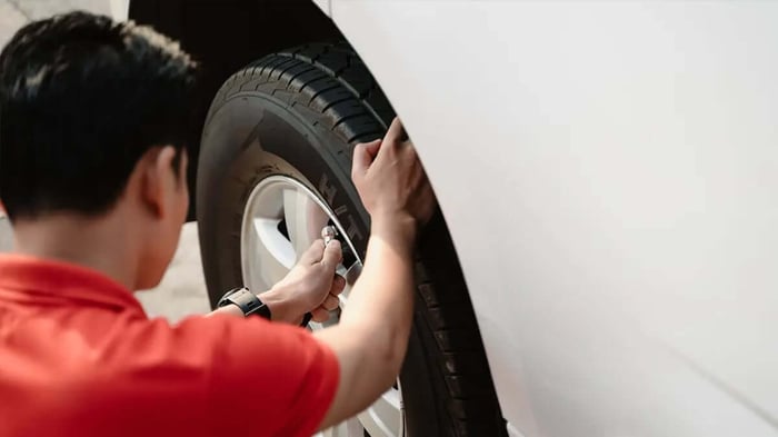 RV tire pressure being checked