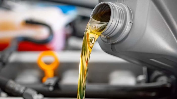 fresh motor oil being poured into an RV