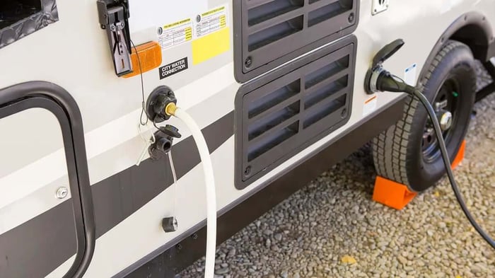 an RV tank system being inspected prior to storage