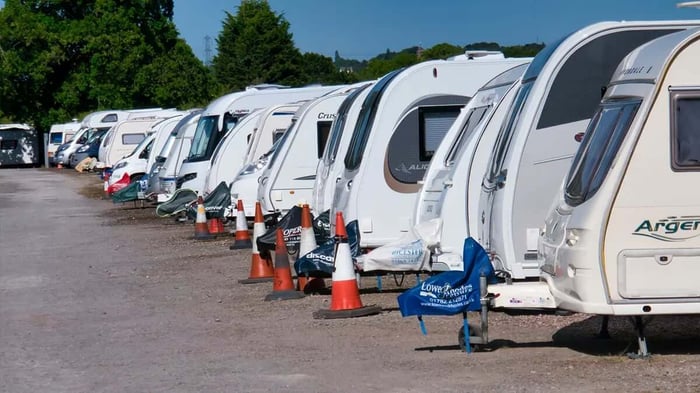 a line of RVs using vehicle parking at Mini Mall Storage