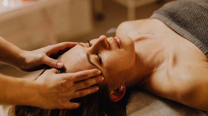 a woman receiving a spa treatment