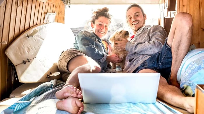 a family with their dog emjoying an RV