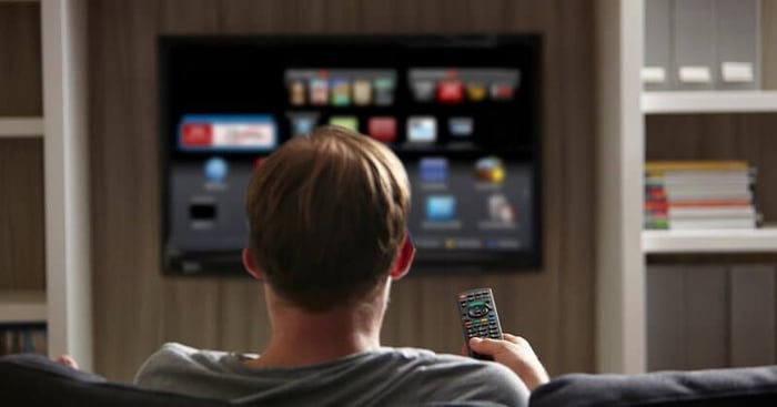 man watching television