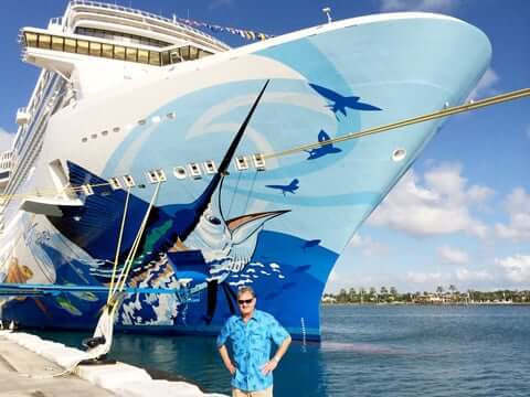 Guy Harvey 40th Anniversary – standing in front of Norwegian Escape cruise ship with custom marine art