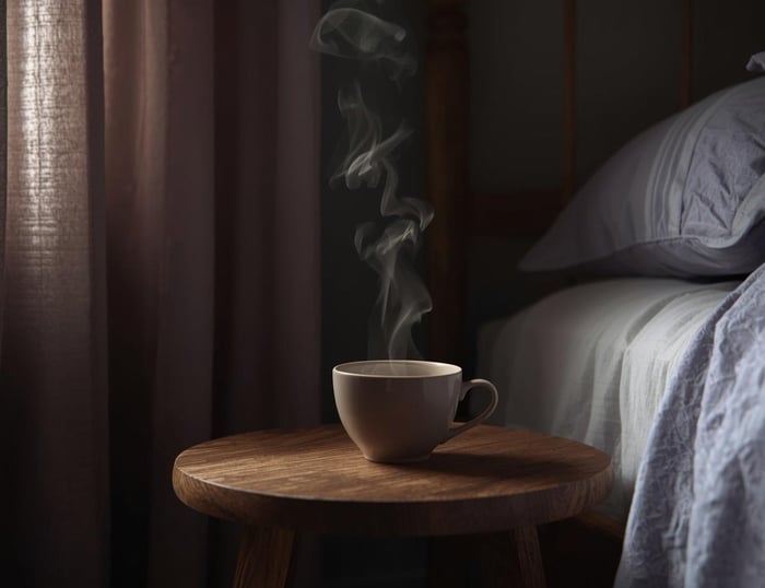 A calming scene of migraine tea beside a quiet resting space.