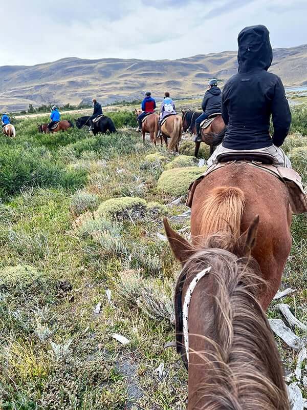 Riders in waterproof jackets on the trail