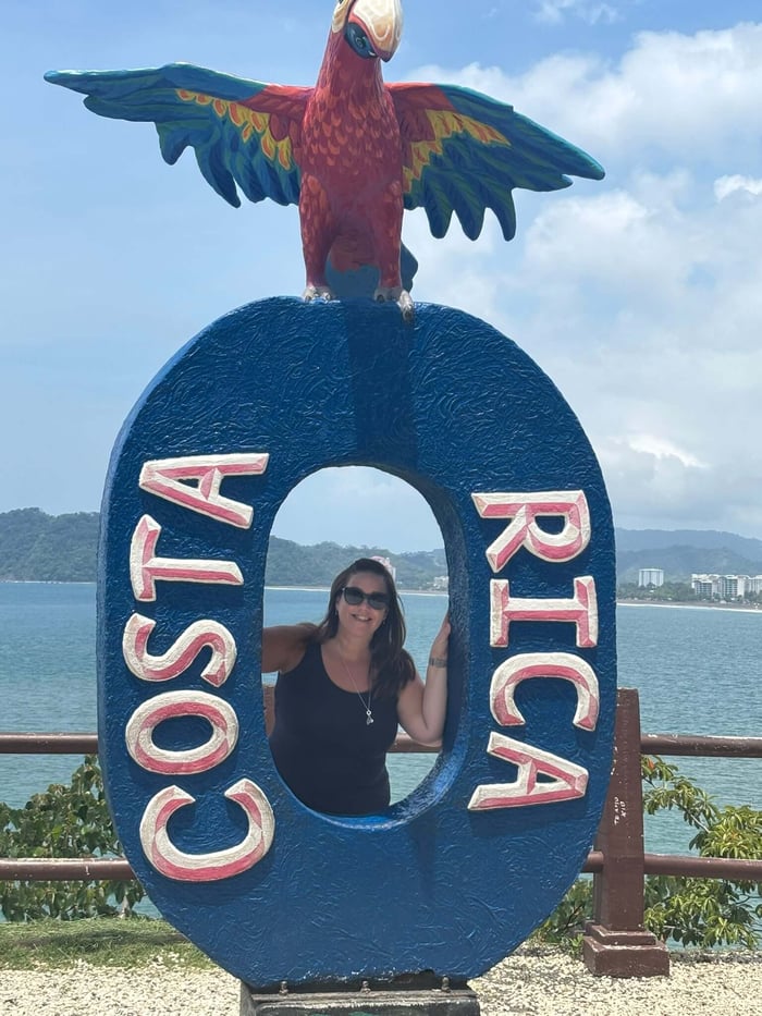 Gaynor at a Costa Rica Sign