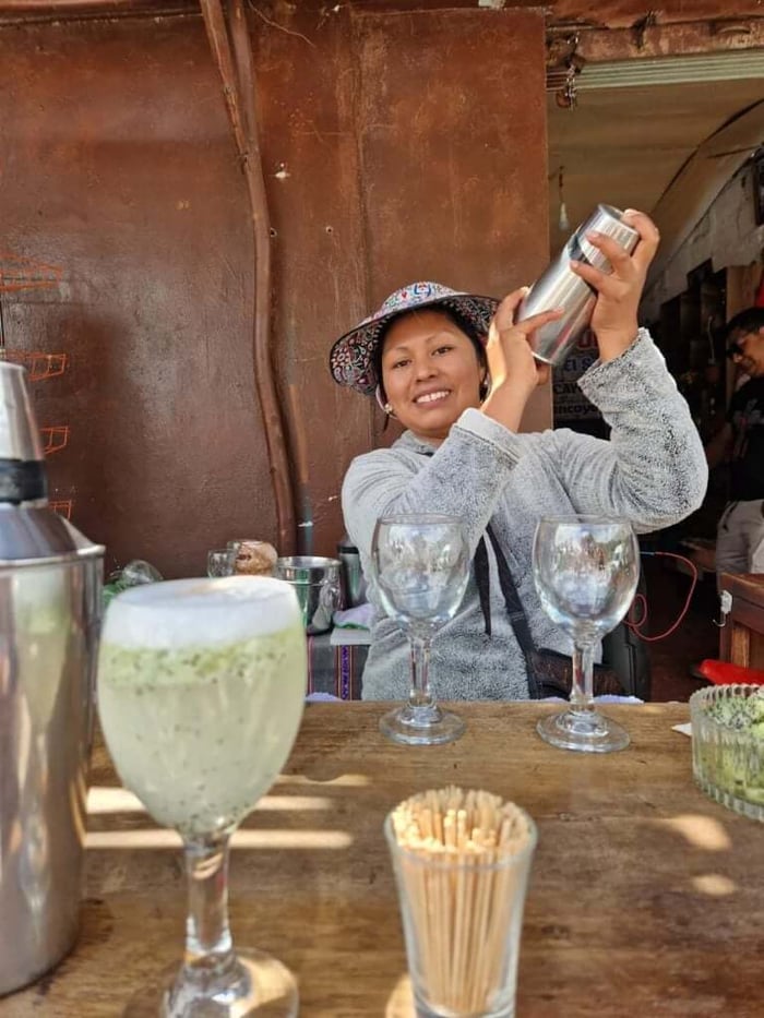 Making Pisco Sours in the local market bar
