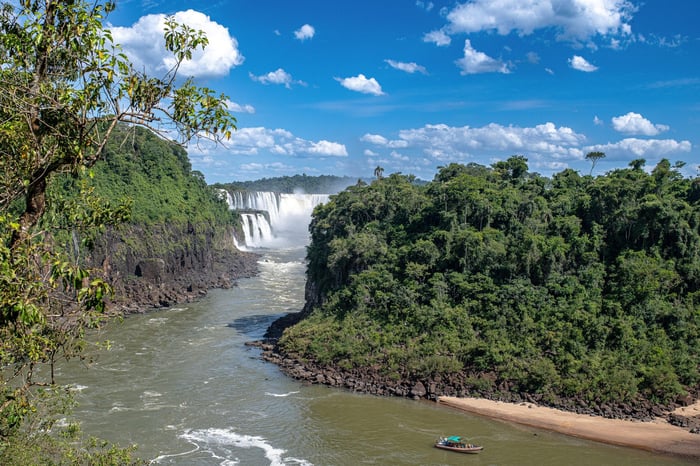 A boat journeys from Iguazu Falls