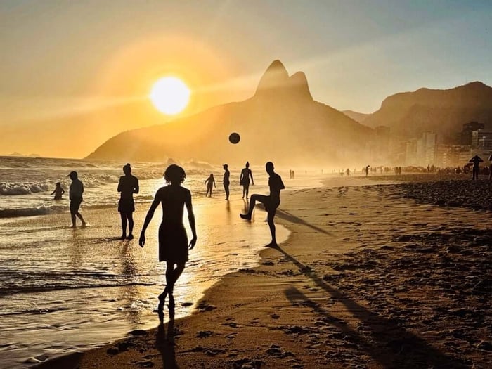 Locals playing football on Ipanema Beach, Rio de Janeiro