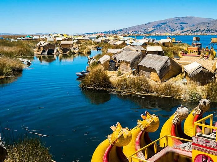 Traditional boats sitting near the floating islands of Uros