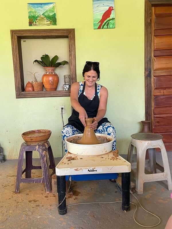 Cat learning pottery