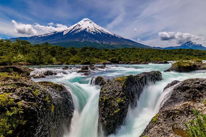 Petrohué Waterfalls with snow-capped Osorno Volcano in the background