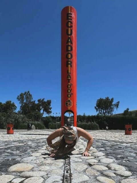 Julia testing the theory that you lose body weight when you are on the equator!