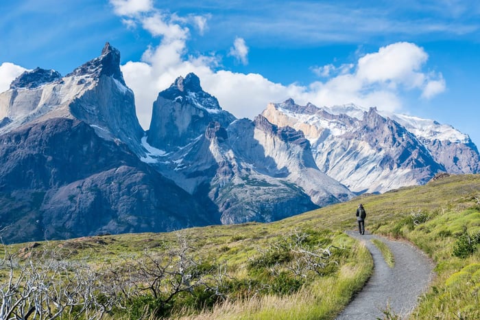 Tourist on the road to Los Cuernos in National Park Torres del Paine in southern Chile, Patagonia.