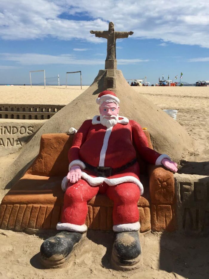 Sand-a-Claus with his feet up on Copacabana Beach