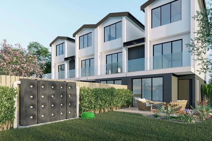 P{roduct render showing bailey slim jim slimline tank installed along fence urban town house