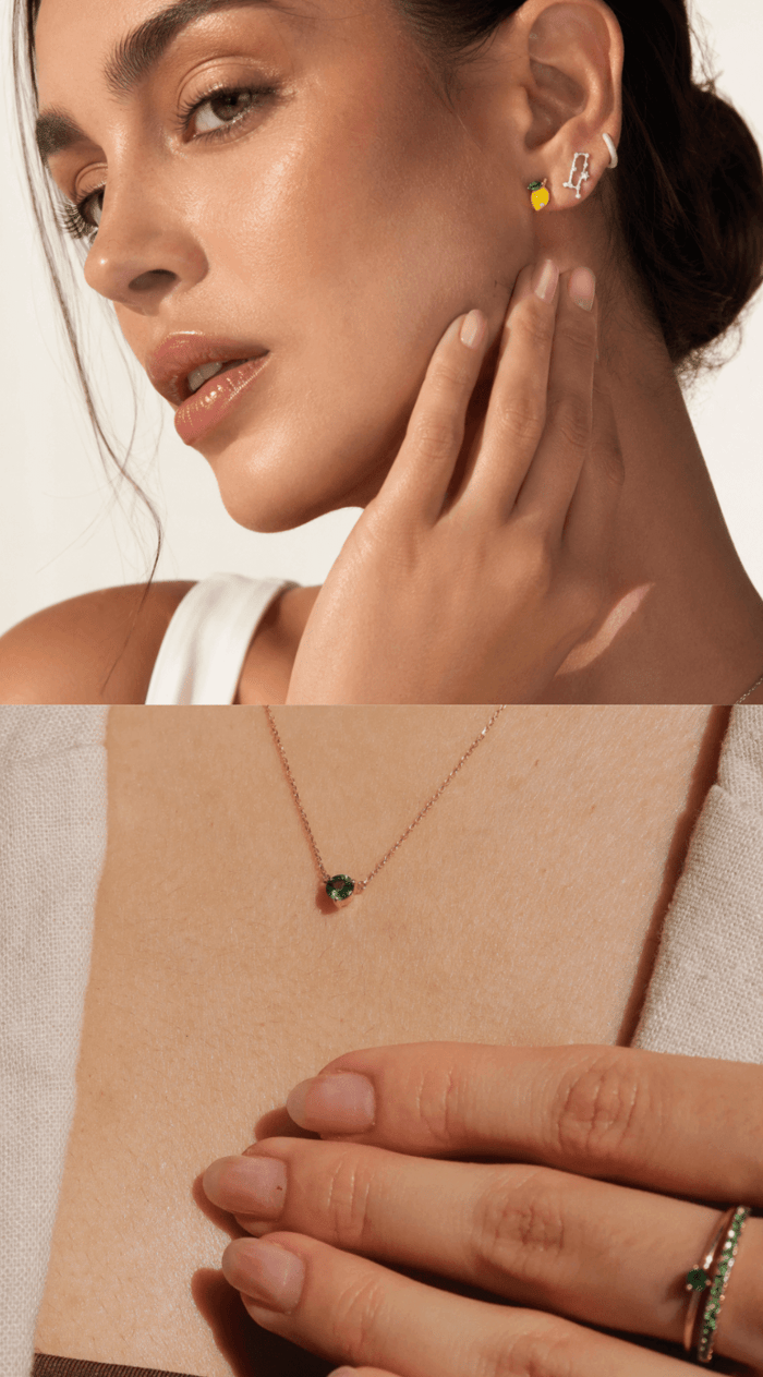 May birthstone emerald necklace styled with gold jewellery